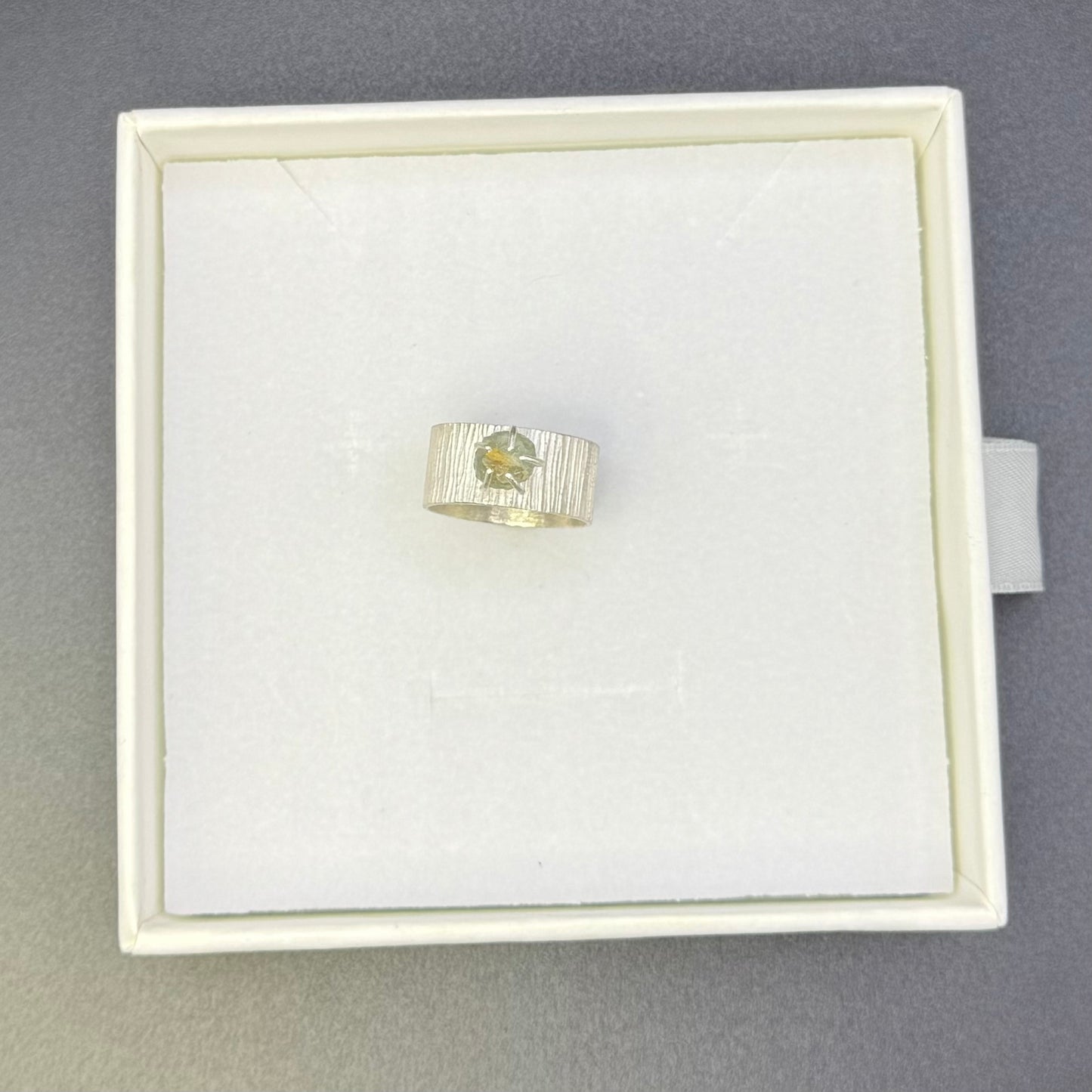 Textured Wide Band Ring with Uncut Bicolor Montana Sapphire