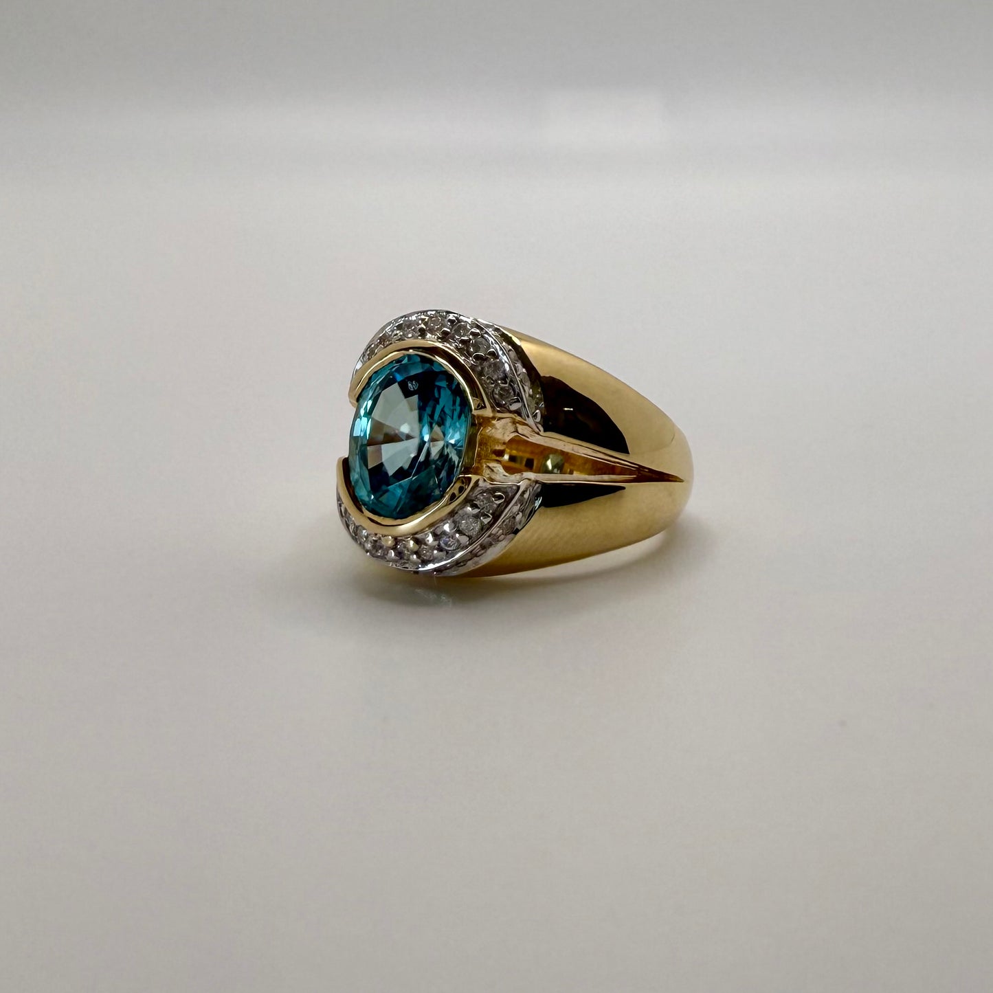 Stunning Blue Zircon & Diamond Halo Ring in 10K Two-Tone Gold
